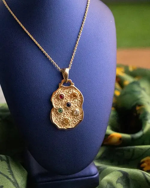 The Nugget Pendant on a navy velvet bust